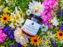 Load image into Gallery viewer, Balance Yin and Yang soy candle surrounded by flowers