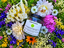 Load image into Gallery viewer, Heart Chakra / Compassion botanical soy candle surrounded by farm flowers