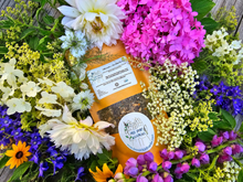Load image into Gallery viewer, Inflammation and Pain Relief herbal tea tonic surrounded by farm flowers