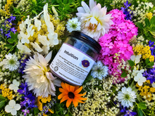Load image into Gallery viewer, Intuition botanical soy candle surrounded by farm flowers