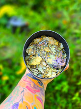 Load image into Gallery viewer, Sleep Potion Tea Tonic herbal blend held over the Wild Indigo Forest Farm garden
