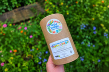 Load image into Gallery viewer, Wild Indigo Forest Farm Flower Confetti bulk restaurant size package held in the flower garden